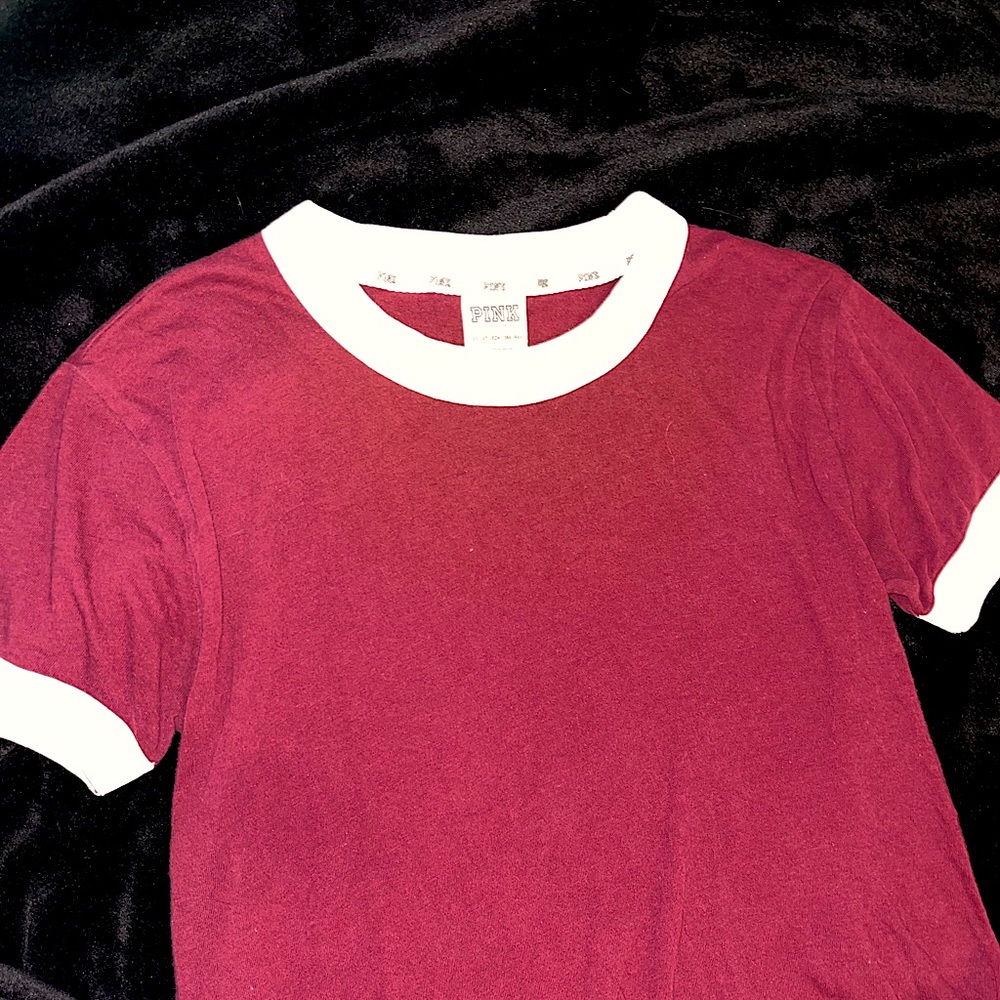 Burgundy VS pink brand t shirt with white bands on neck and sleeves